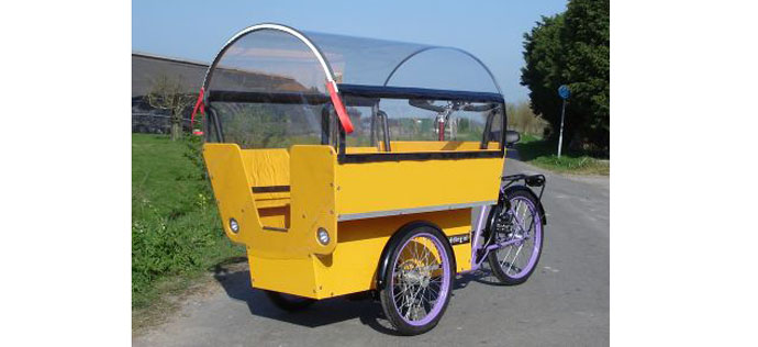 A pedal-powered yellow school bus
