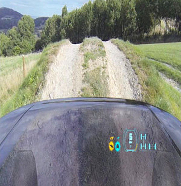 A driver's view - the head-up display shows the ground and front wheels beneath the car