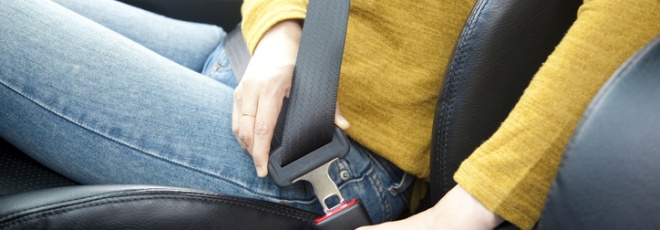 UK driver fastening seat belt